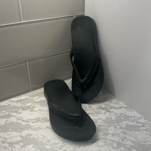 Archies black flip flops